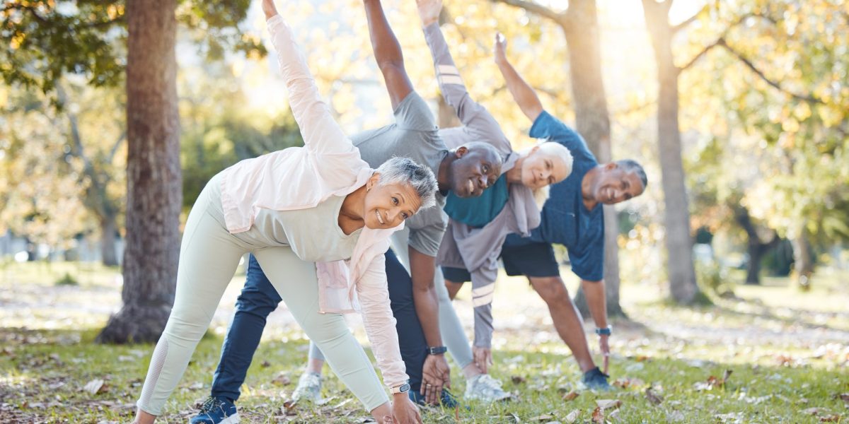 Yoga, park and old people stretching, fitness and exercise with happiness, wellness and stress relief. Senior women, nature and elderly men outdoor, relax and workout goal with progress and health.
